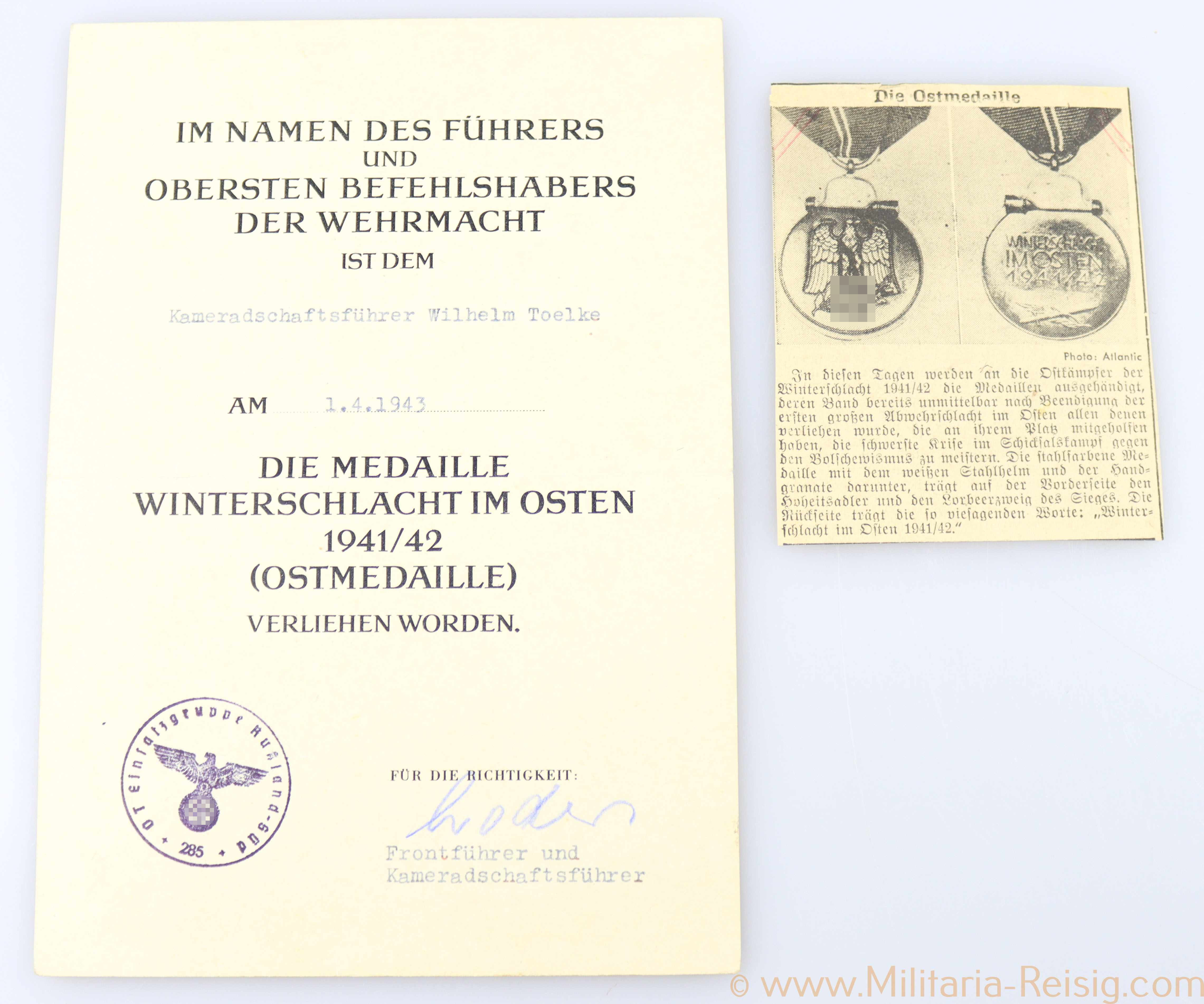 Verleihungsurkunde zur Ostmedaille und Zeitungsabschnitt